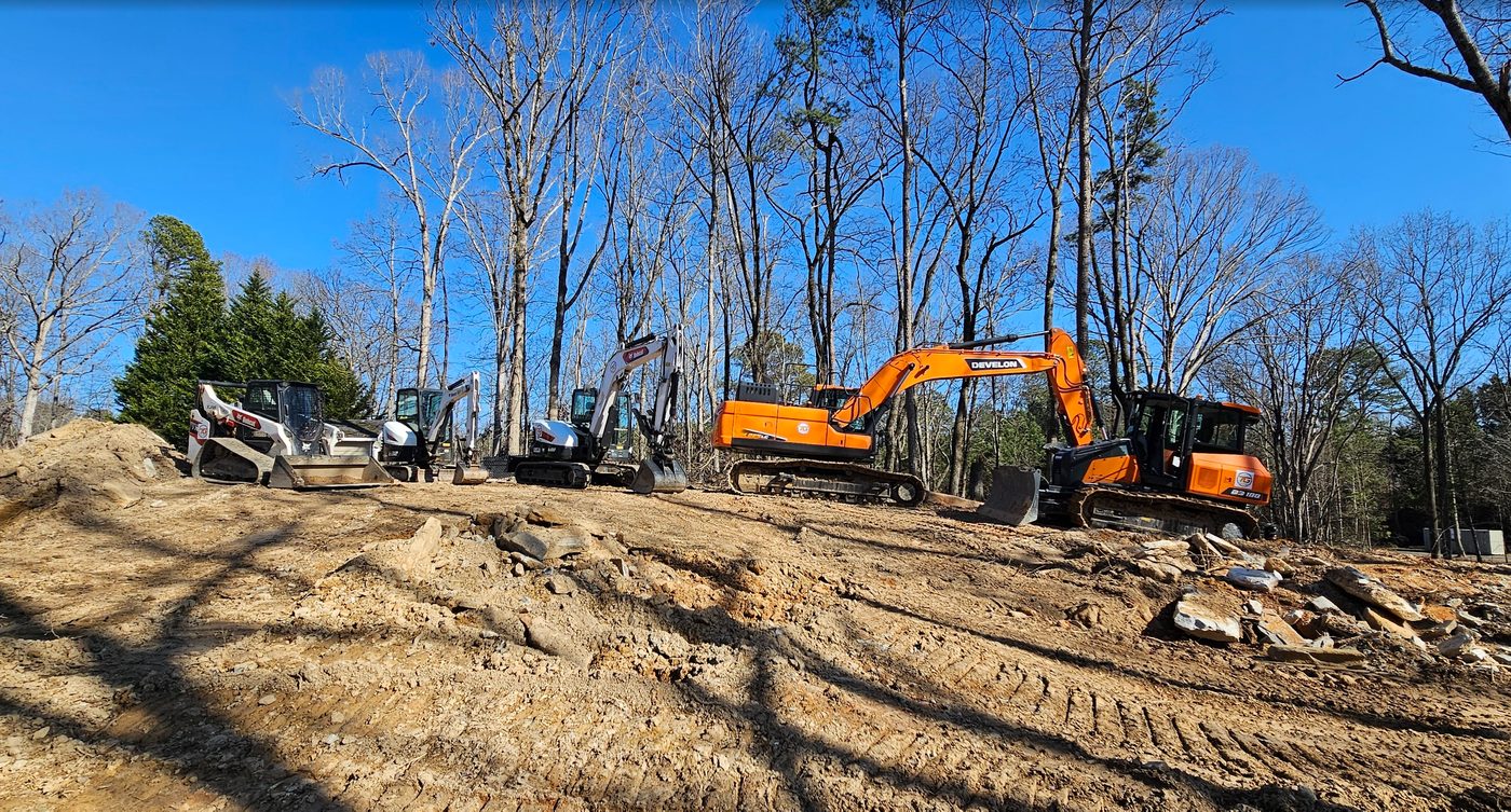 Excavator grading a site in Georgia